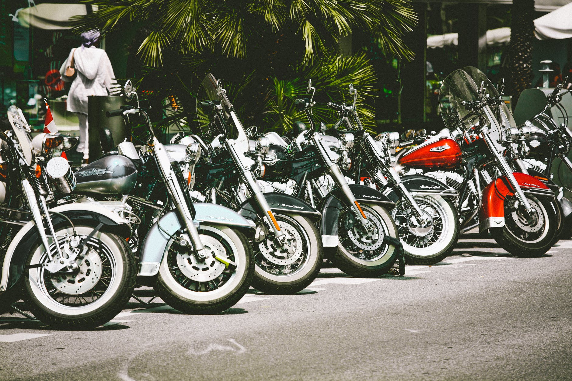 photo of motorcycles parked on street