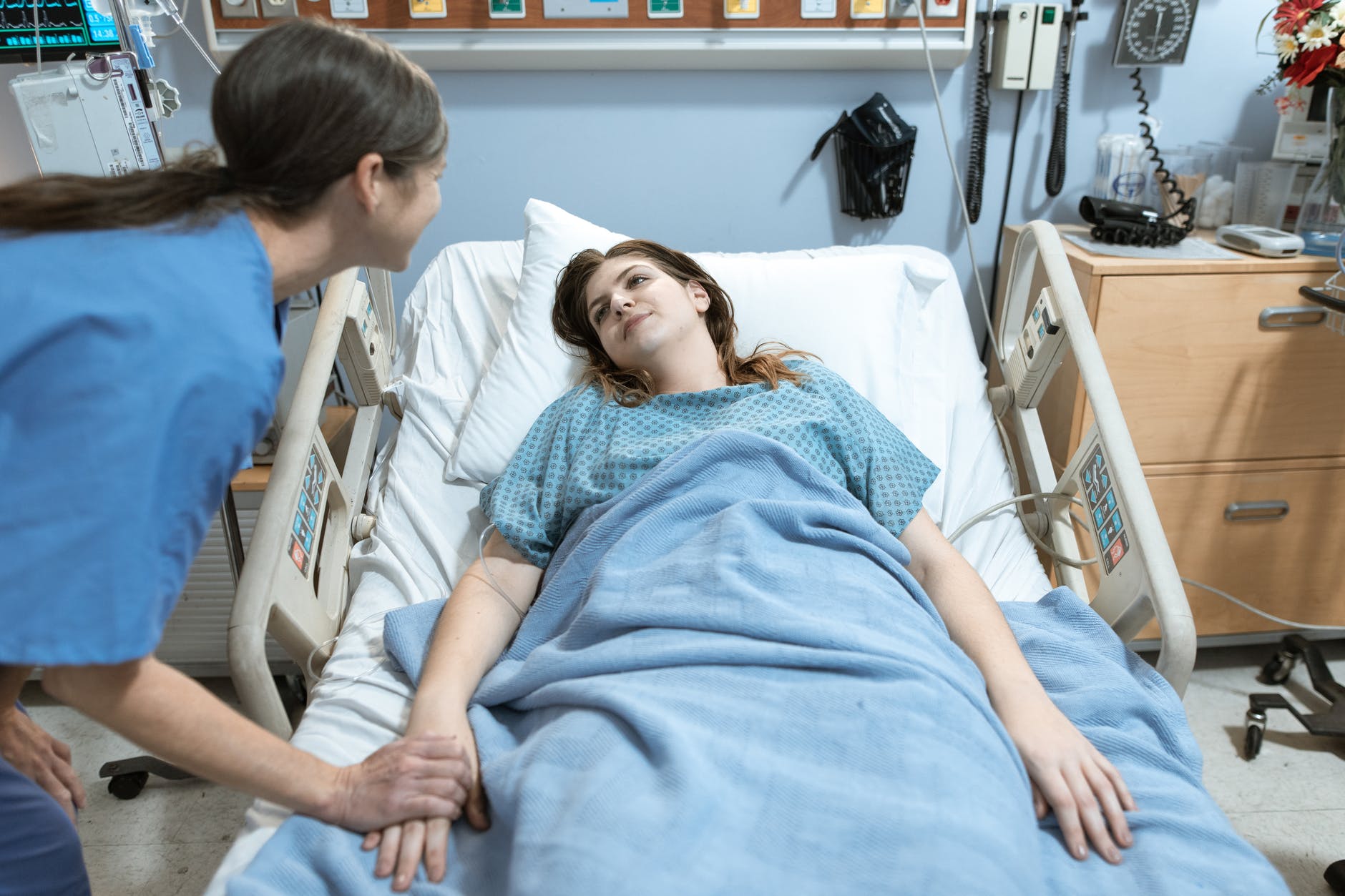 a woman talking to a patient