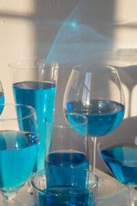 glasses with blue colored drink