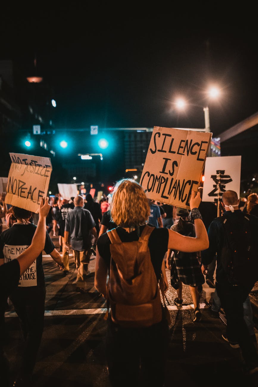 protesters holding signs