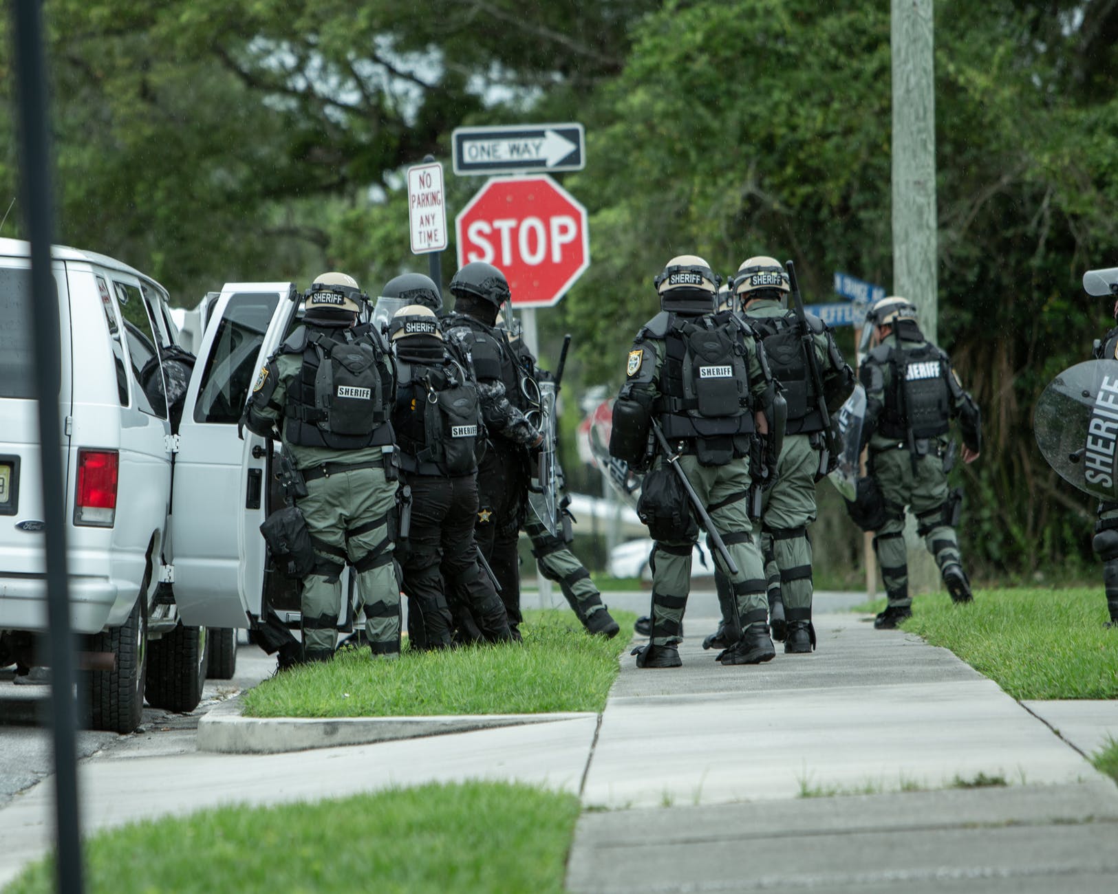 armed combat forces on american street