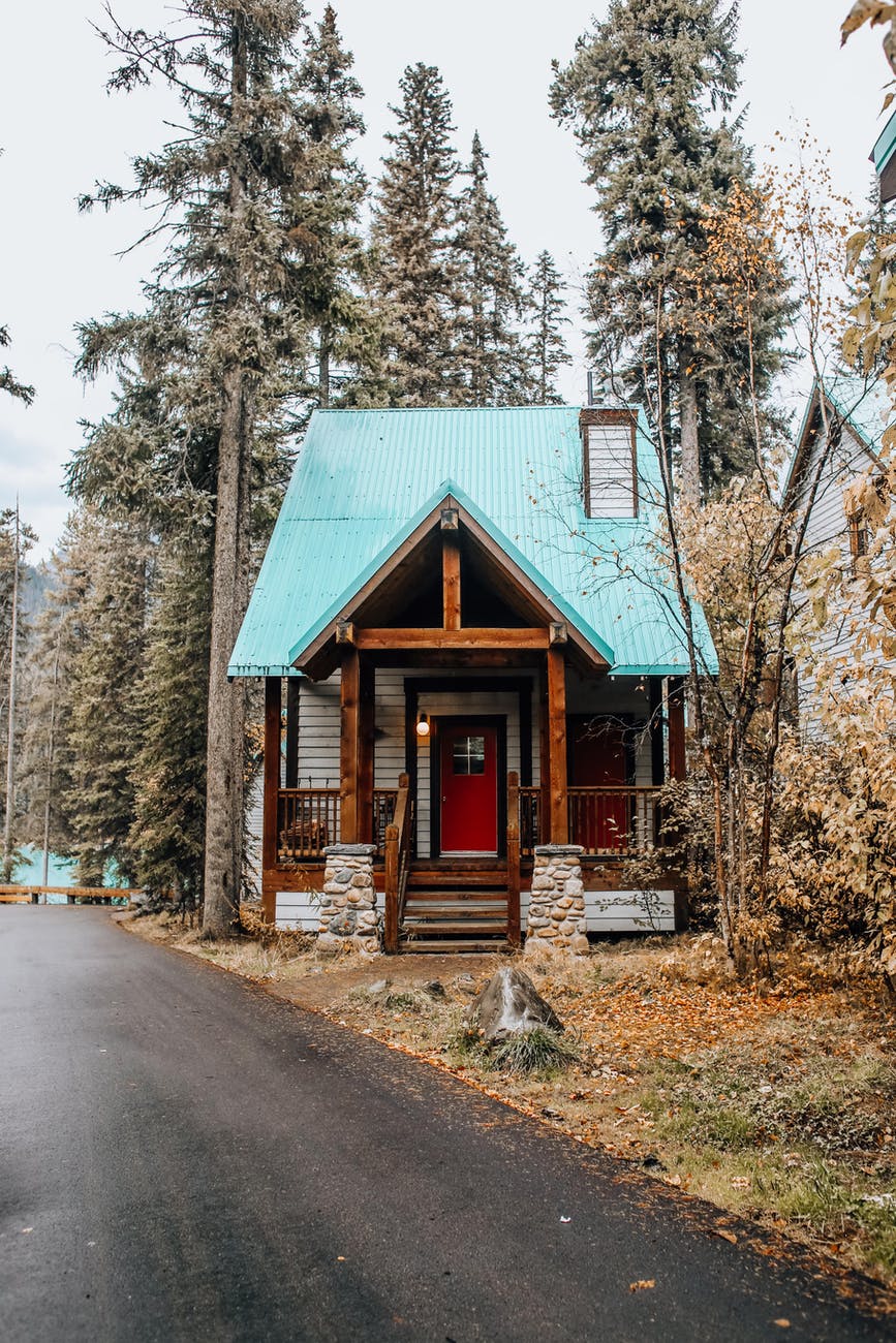 house beside an asphalt road