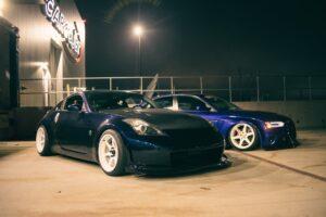 sports cars on the parking lot at night