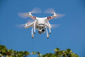 drone flying against blue sky