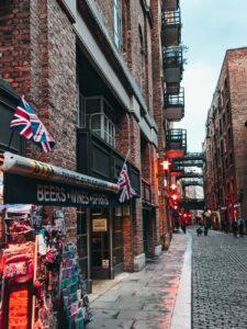 photo of stores under brick buildings