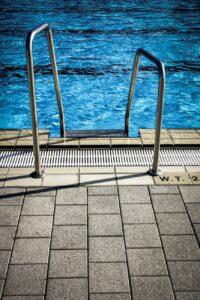 white metal railings near swimming pool