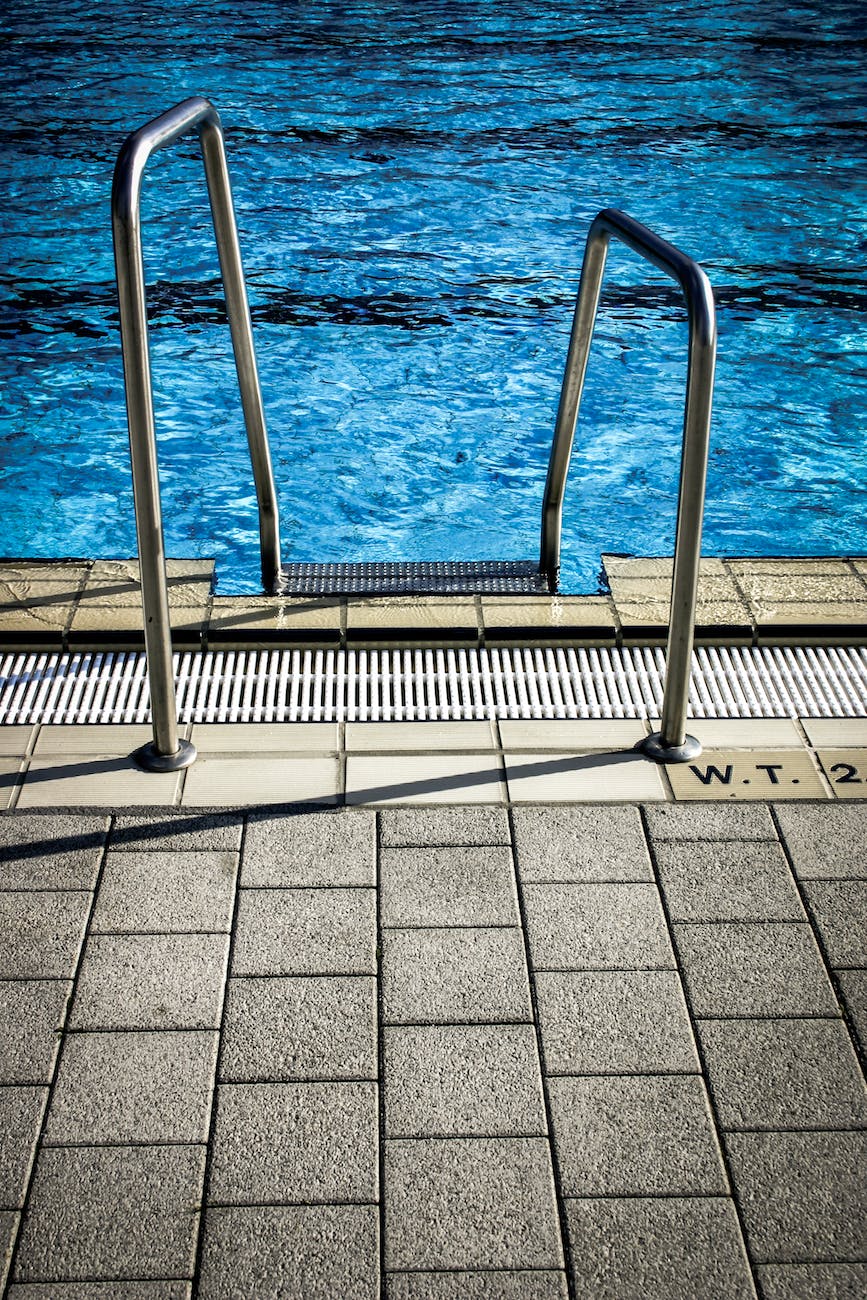 white metal railings near swimming pool