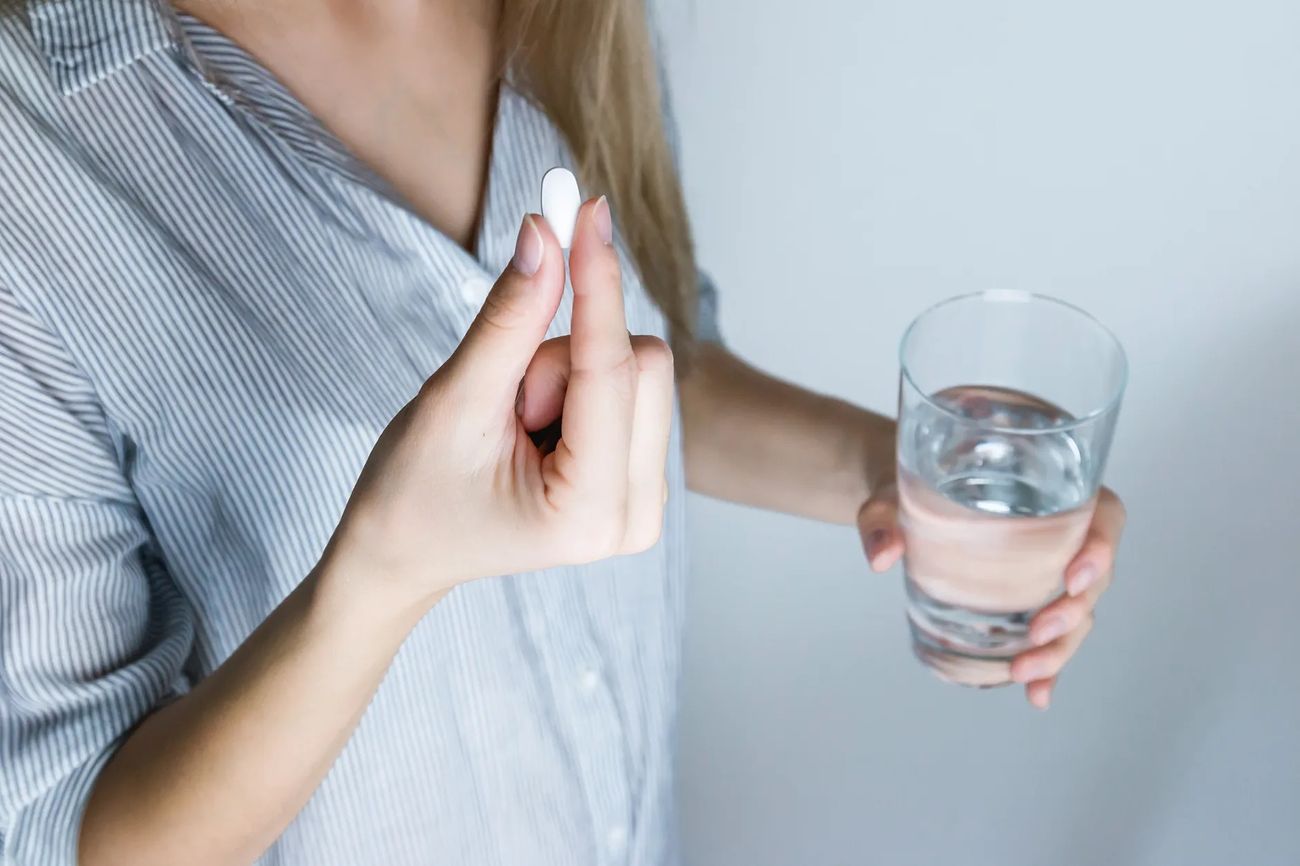 Woman taking medicine