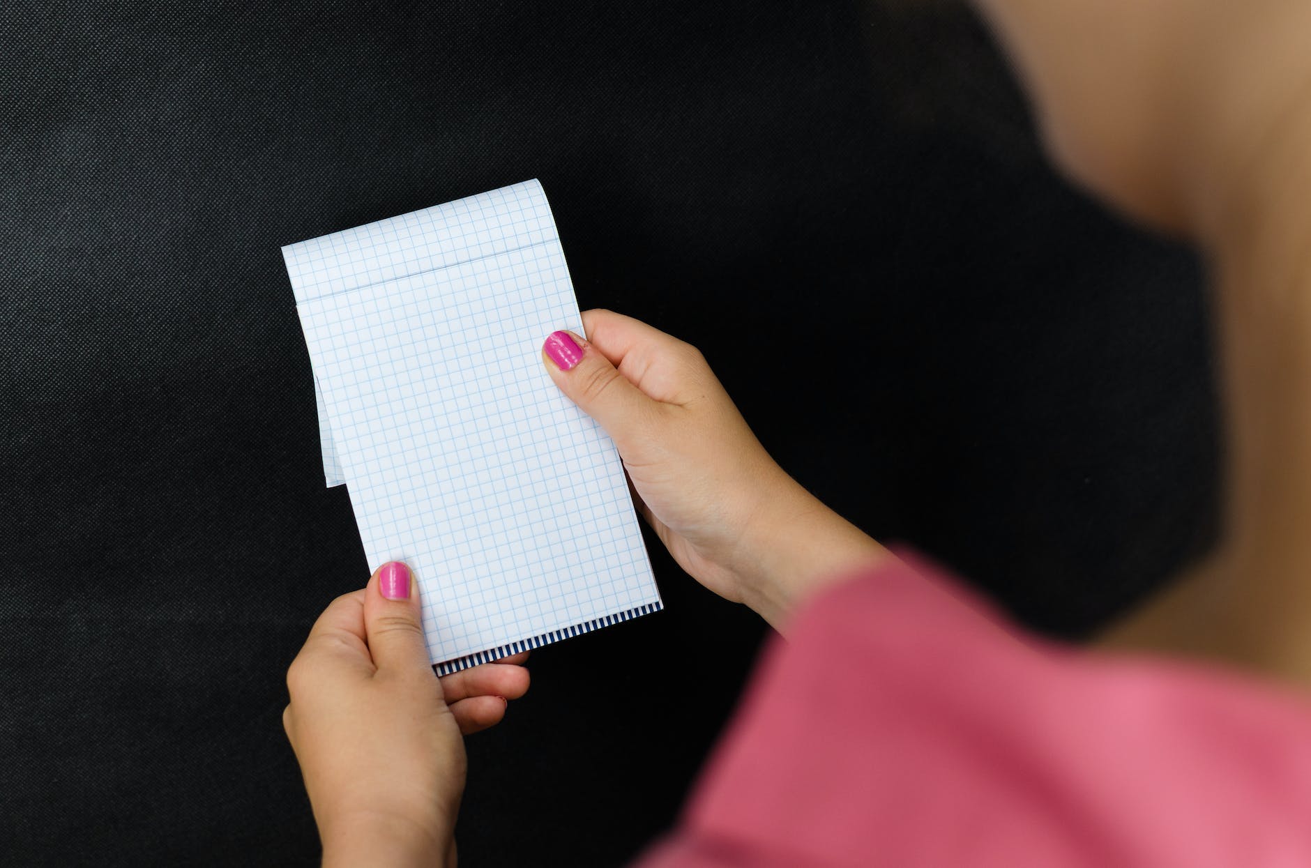 person holding white textile