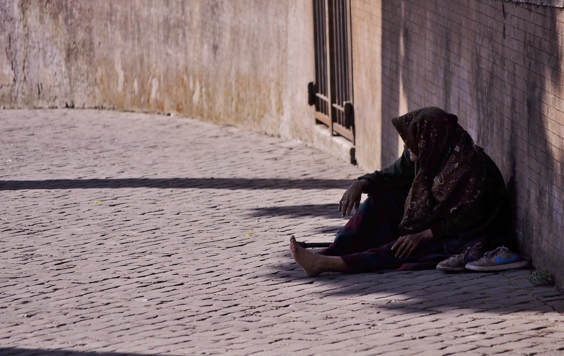 man sitting near wall