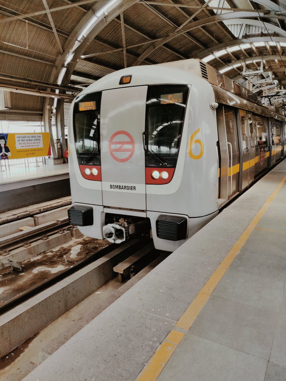 gray train parking in train station