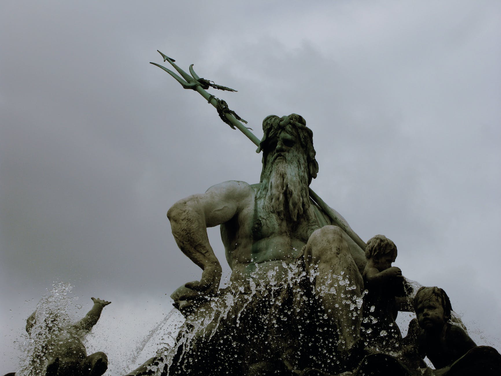 clouds over poseidon statue