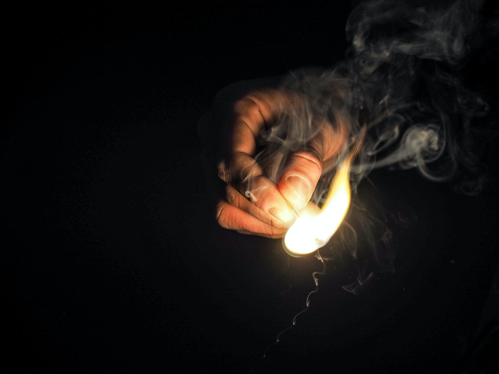 person holding matchstick