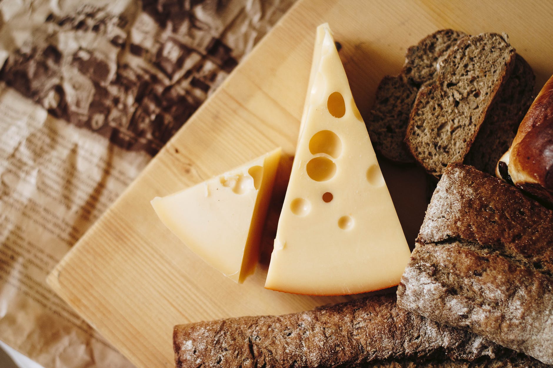 sliced cheese on brown table top