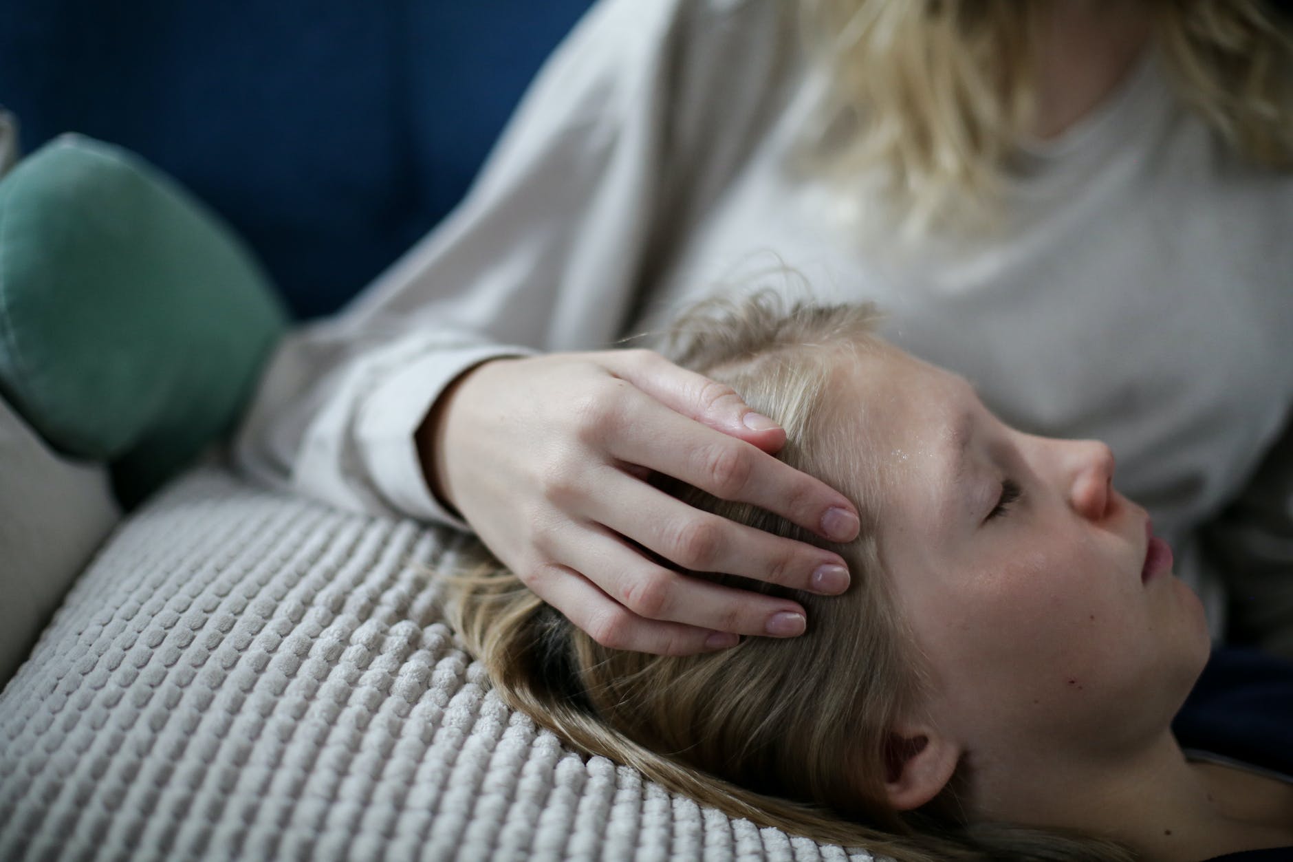 a boy lying on the couch