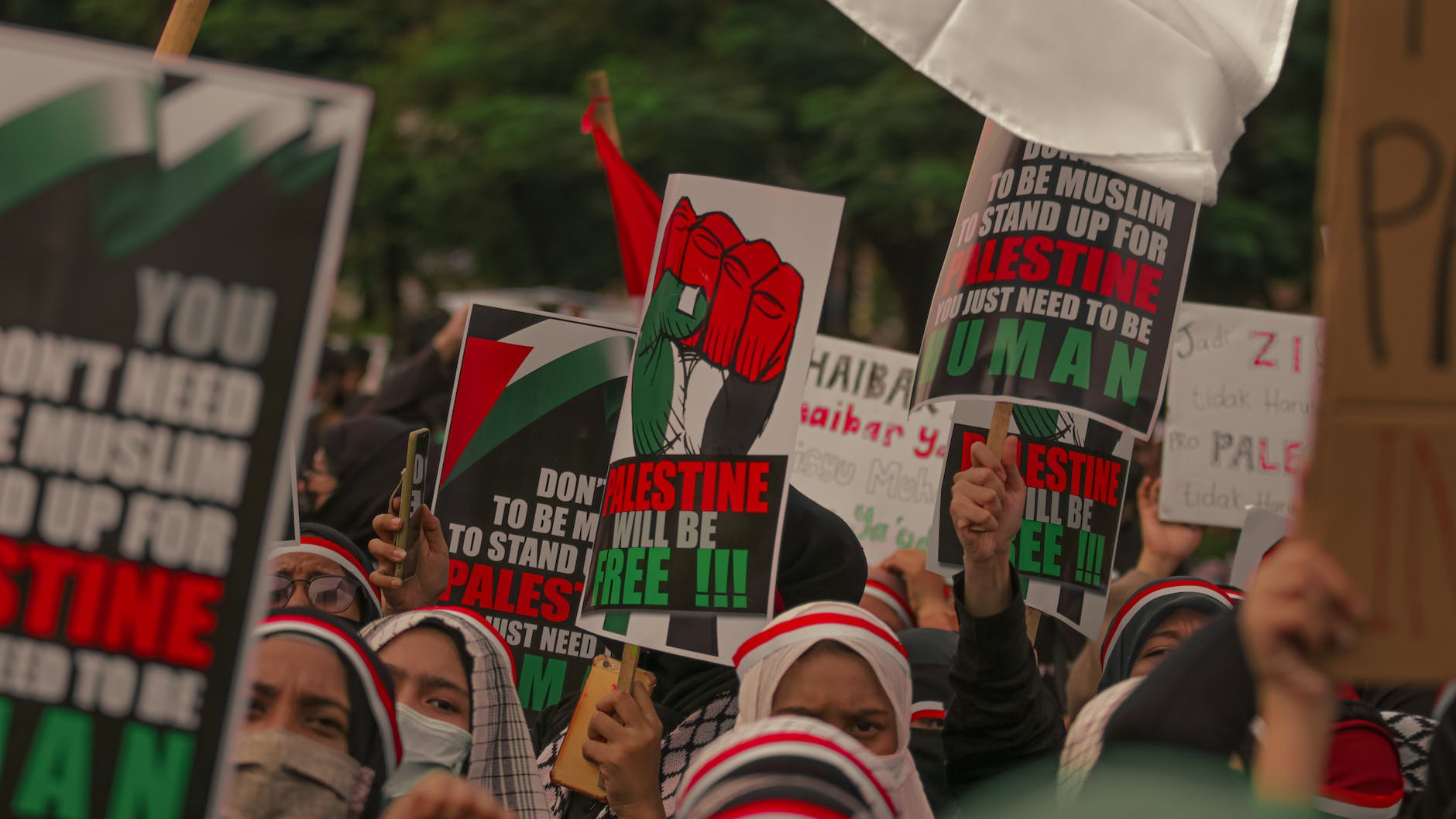 protesters holding posters during their rally