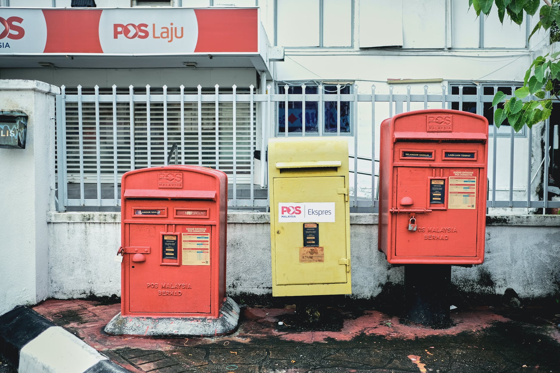 red and yellow mailboxes